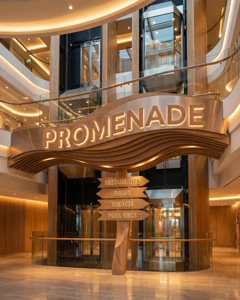 Illustration: cruise ship atrium with a sculpted sign reading PROMENADE and carved directional blades