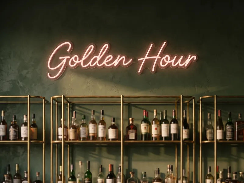 Illustration: script sign reading Golden Hour above a brass back bar